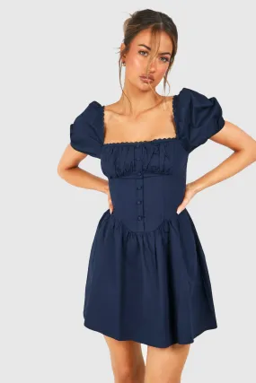 Robe courte froncée en coton à manches bouffantes